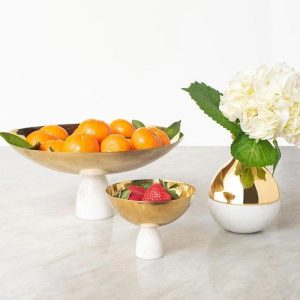 Assorted fresh fruits in a colorful decorative bowl